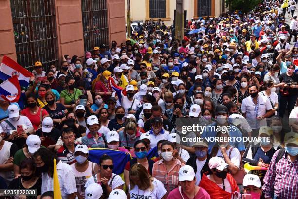 Teachers from across the country take part in a demonstration to demand higher salaries outside the Economy Ministry building in Asuncion, on October...