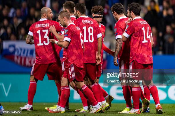 Georgi Dzikiya of Russia celebrates with his team-mates after scoring Russia's second goal during the 2022 FIFA World Cup Qualifier match between...