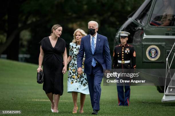 Granddaughter Naomi Biden, U.S. President Joe Biden and first lady Jill Biden exit Marine One on the South Lawn of the White House October 11, 2021...