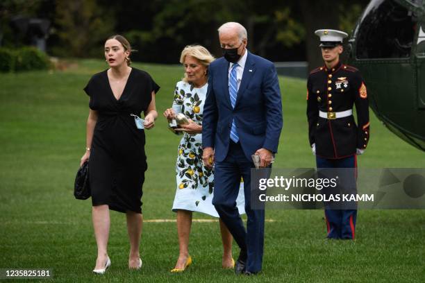 President Joe Biden walks to the White House with First Lady Jill Biden and their granddaughter Naomi Biden upon his return from Delaware in...