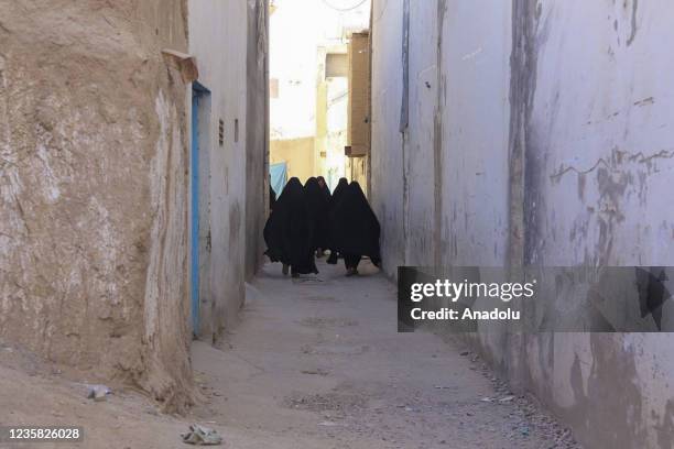 Women walk at a street in Kandahar, Afghanistan on September 29, 2021. Hazaras are known as the largest Shiite group in the country as they are...