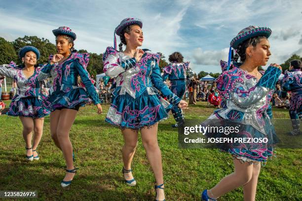 The Pumawari Tusuy group performs for the crowd gathered in the park at the first Annual Indigenous Peoples' Day Ceremonial Celebration in Newton,...