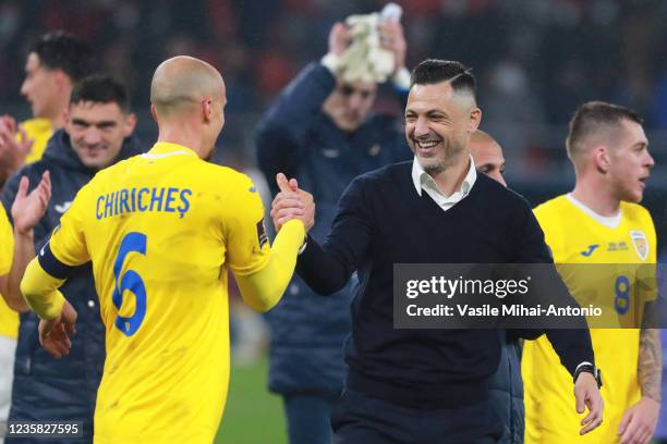 The coach of the Romanian team, Mirel Radoi enjoys together with the team captain, Vlad Chiriches during the 2022 FIFA World Cup Qualifier match...