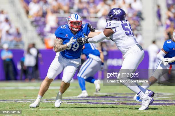 Mustangs defensive tackle Harrison Loveless tries to get around the block of TCU Horned Frogs offensive tackle Obinna Eze during the college football...