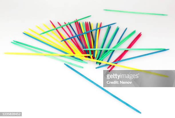 mikado pick-up sticks game isolated on white background - mikado stock pictures, royalty-free photos & images