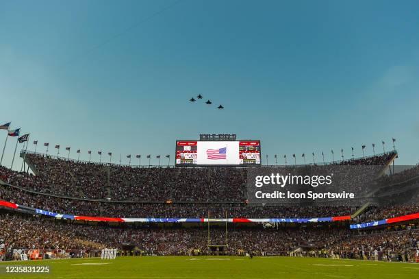Flight of 2 x F-15C's and 2 x F-22's fly over Kyle Field at the end of the Nation Anthem before the game between the Alabama Crimson Tide and the...