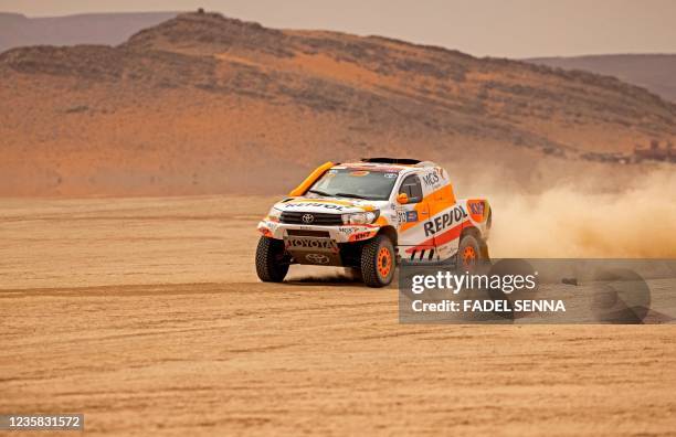 Spanish pair Isidre Esteve and his co-driver Txema Villalobos compete in their Toyota Hilux during the Rally of Morocco 2021 in Drâa-Tafilalet region...