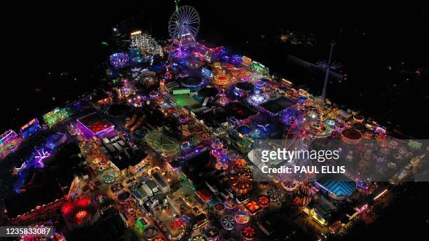An aerial view shows the rides and stalls at the Hull Fair on October 11, 2021. - The Hull Fair, one of Europe's largest travelling fairs, returned...