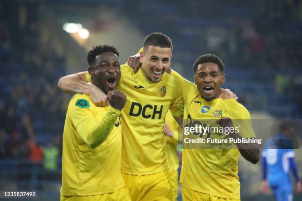 Players of FC Metalist Kharkiv Kadeem Harris, Matheus Peixoto, Jose Brayan Riascos hug during the Ukrainian First League matchday 13 game against FC...