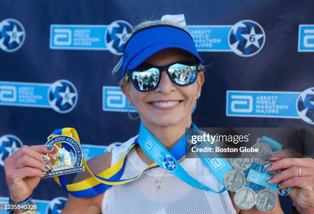 Amy Pelzel from Denton TX, a recipient of the World Marathon Majors "Six Star" medals, after the finish line of the 125th Boston Marathon in Boston...