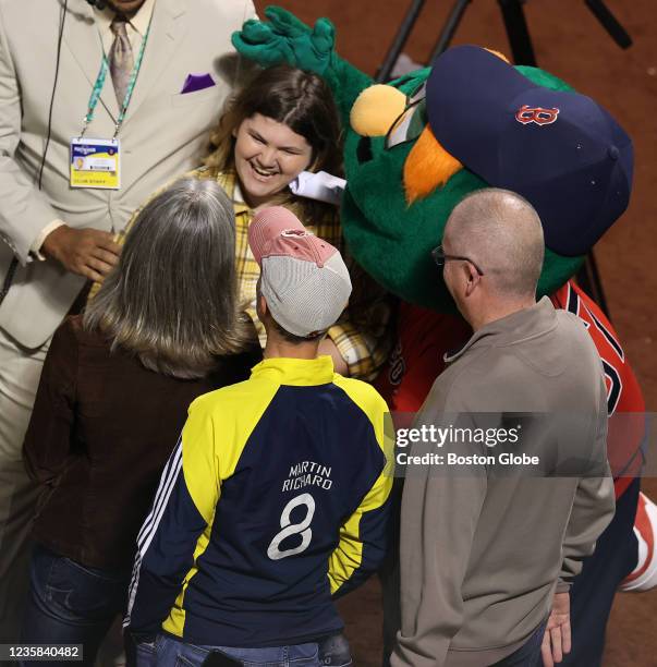 Boston Marathon bombing survivor Jane Richard with Wally The Green Monster before the game. The Boston Red Sox host the Tampa Bay Rays in Game 4 of...