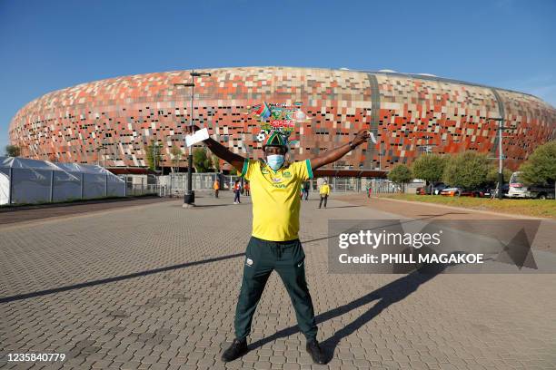 South African national football team supporter reacts after being processed to attend the FIFA World Cup Qatar 2022 qualifying round Group G football...