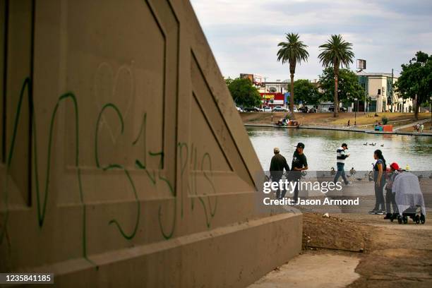 Gang related graffiti mark territory in MacArthur Park a location that has become an important source of revenue for the MS-13 gang, whose members...