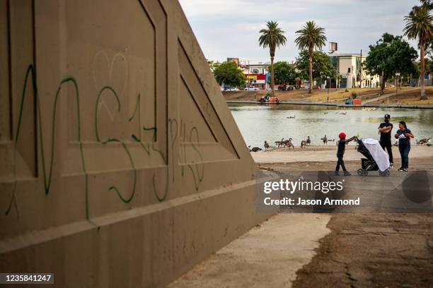 Gang related graffiti mark territory in MacArthur Park a location that has become an important source of revenue for the MS-13 gang, whose members...