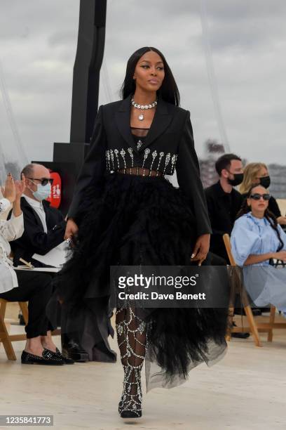 Naomi Campbell walks the runway at the Alexander McQueen SS22 Womenswear show at Tobacco Dock on October 12, 2021 in London, England.
