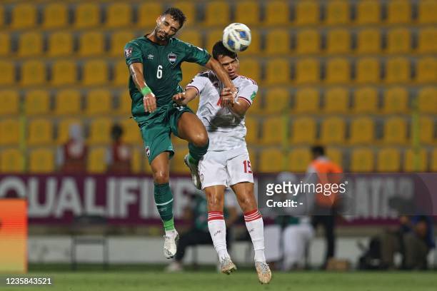 Iraq's defender Ali Adnan vies for the header with UAE's forward Fabio Lima during the 2022 Qatar World Cup Asian Qualifiers football match between...