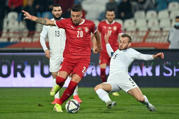 Serbia's midfielder Sergej Milinkovic-Savic fights for the ball with Azerbaijan's defender Maksim Medvedev during the FIFA World Cup 2022 Group A...