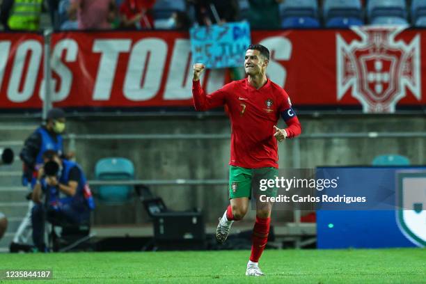 Cristiano Ronaldo of Manchester United and Portugal celebrates scoring Portugal first goal during the 2022 FIFA World Cup Qualifier match between...