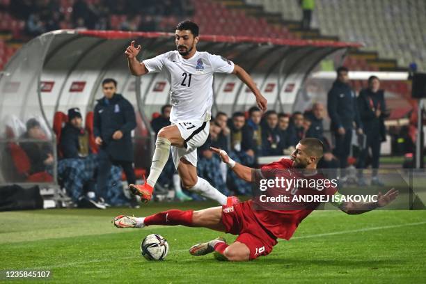 Azerbaijan's midfielder Araz Abdullayev fights for the ball with Serbia's defender Matija Nastasic during the FIFA World Cup 2022 Group A...