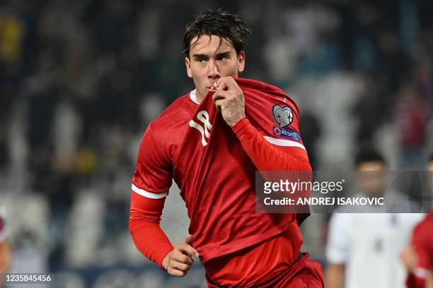 Serbia's forward Dusan Vlahovic celebrates after scoring during the FIFA World Cup 2022 Group A qualification football match between Serbia and...