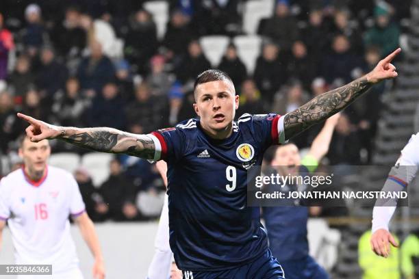 Scotland's forward Lyndon Dykes celebrates scoring the 1-0 goal during the football match between Faroe Islands and Scotland, in the Torsvollur...