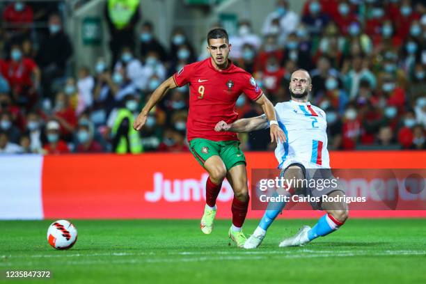 Andre Silva of RB Leipzig and Portugal tries to escape Chanot of Luxembourg during the 2022 FIFA World Cup Qualifier match between Portugal and...