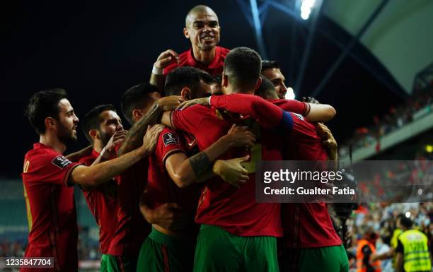 Cristiano Ronaldo of Portugal celebrates with teammates after scoring a goal during the 2022 FIFA World Cup Qualifier match between Portugal and...