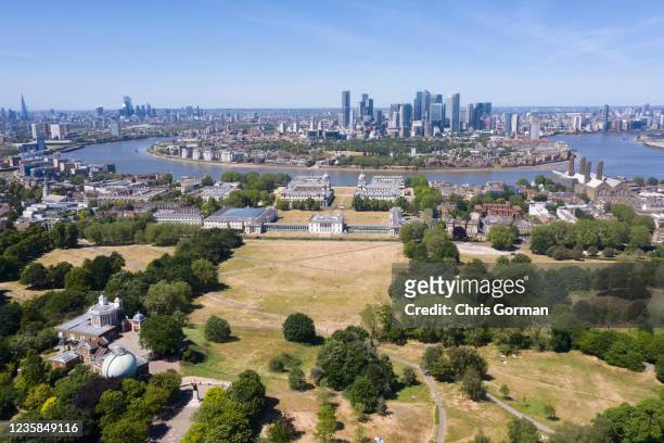 Very dry Greenwich Park sits beside the Isle of Dogs in this image by drone on May 29, 2020 in Greenwich, London.