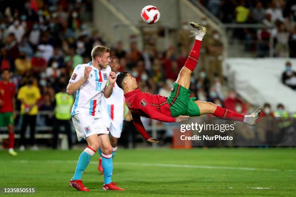 Portugal's forward Cristiano Ronaldo attempts a bicycle kick shot on goal during the FIFA World Cup Qatar 2022 qualification group A football match...