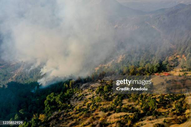 Firefighter plane battles against the forest fire broke out in Kemer district as ground and aerial extinguishing operations continue in Antalya,...