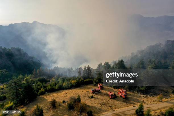 Firefighter plane battles against the forest fire broke out in Kemer district as ground and aerial extinguishing operations continue in Antalya,...