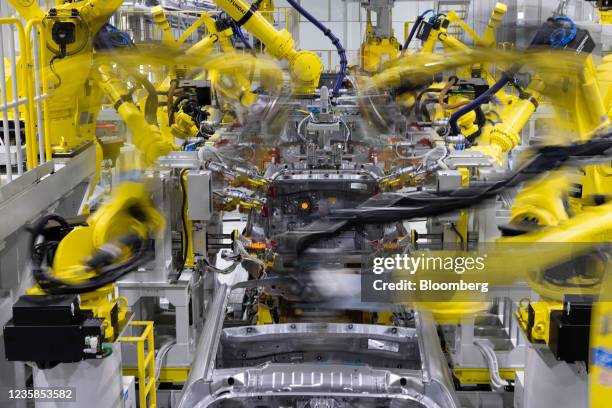 Robots assemble Hyundai Motor Co. Casper mini sport utility vehicles on the production line at the Gwangju Global Motors factory in Gwangju, South...