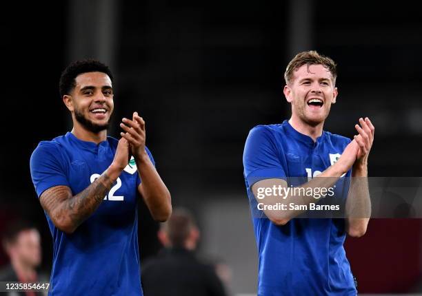 Dublin , Ireland - 12 October 2021; Andrew Omobamidele, left, and Nathan Collins, both of Republic of Ireland, applaud the supporters after the...