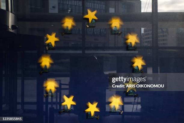 The European flag with stars that woble is pictured at the European Commission headquarters building, in Brussels on October 13, 2021.