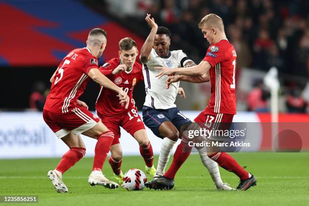 Raheem Sterling of England in action with Zsolt Nagy, Szabolcs Schon and Andras Schafer of Hungary during the 2022 FIFA World Cup Qualifier match...