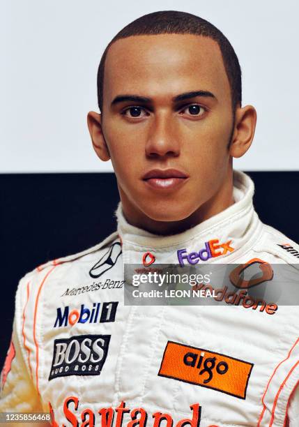 Wax figure of British Formula One world champion Lewis Hamilton is unveiled at the Madame Tussauds waxwork museum in London, on March 18, 2009. AFP...