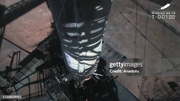 Screenshot taken from a live handout video on October 13, 2021 shows Blue Origin spacecraft New Shepard prepares to take-off in Texas, the United...