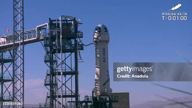 Screenshot taken from a live handout video on October 13, 2021 shows Blue Origin spacecraft New Shepard prepares to take-off in Texas, the United...