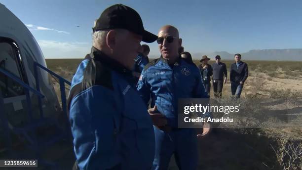 Screenshot taken from a live handout video on October 13, 2021 shows Jeff Bezos talks to William Shatner after Blue Origin's New Shepard crew capsule...