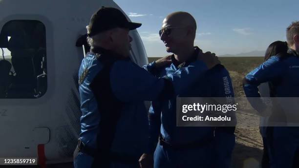 Screenshot taken from a live handout video on October 13, 2021 shows Jeff Bezos talks to William Shatner after Blue Origin's New Shepard crew capsule...