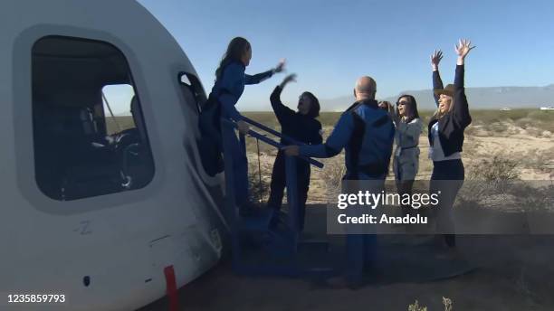 Screenshot taken from a live handout video on October 13, 2021 shows Jeff Bezos greets William Shatner and other crew members of Blue Origin's New...