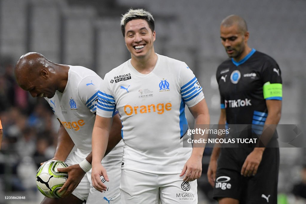 TOPSHOT-FBL-FRA-CHARITY-PEOPLE-HEROES-UNICEF