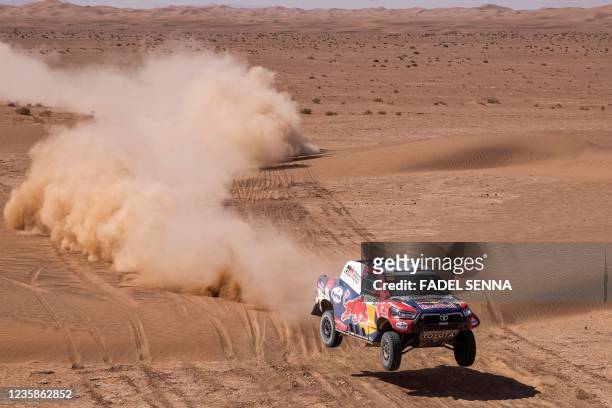Qatari driver Nasser Al-Attiyah and French co-driver Matthieu Baumel compete during the Rally of Morocco 2021, in the region of M'hamid el Ghizlane,...