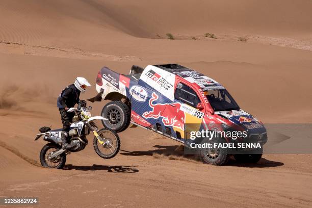 Qatari driver Nasser Al-Attiyah and French co-driver Matthieu Baumel compete during the Rally of Morocco 2021, in the region of M'hamid el Ghizlane,...