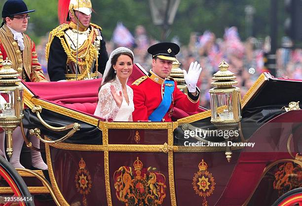 Prince William, Duke of Cambridge and Catherine, Duchess of Cambridge greet crowd of admirers while arriving to Buckingham Palace on April 29, 2011...