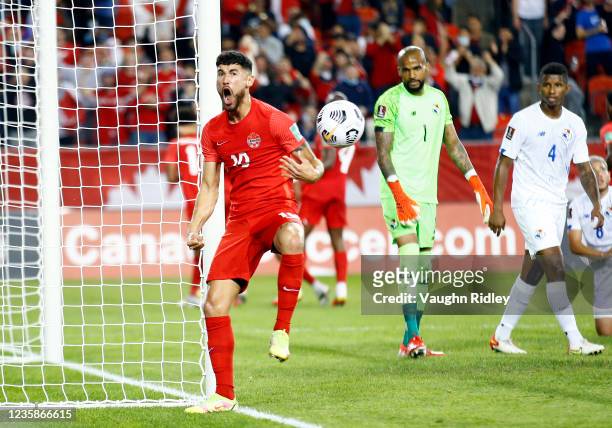 Jonathan Osorio of Canada celebrates a goal by Tajon Buchanan during a 2022 World Cup Qualifying match against Panama at BMO Field on October 13,...