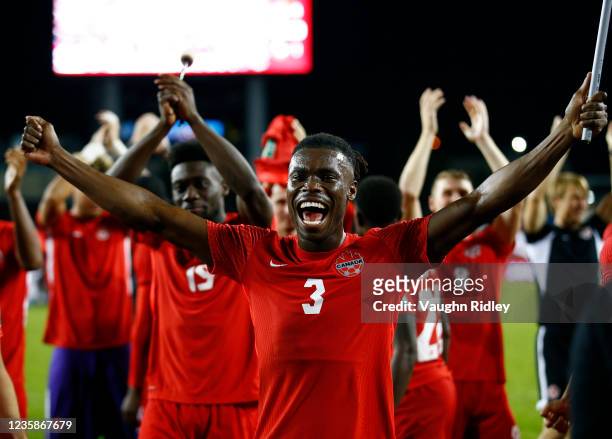 Samuel Adekuge of Canada celebrates with teammates and fans following the final whistle of a 2022 World Cup Qualifying match against Panama at BMO...