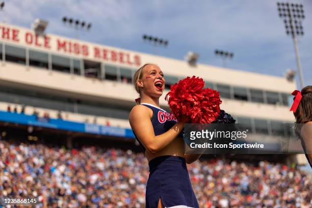 An Ole Miss Rebels cheerleader gets the crowd fired up during the college football game between the Ole Miss Rebels and the Arkansas Razorbacks on...