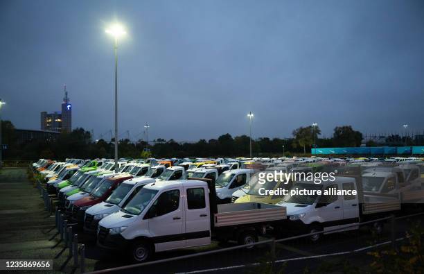 October 2021, Lower Saxony, Hanover: New commercial vehicles from Mercedes-Benz are parked in a car park at the Hanover trade fair. The permanent...