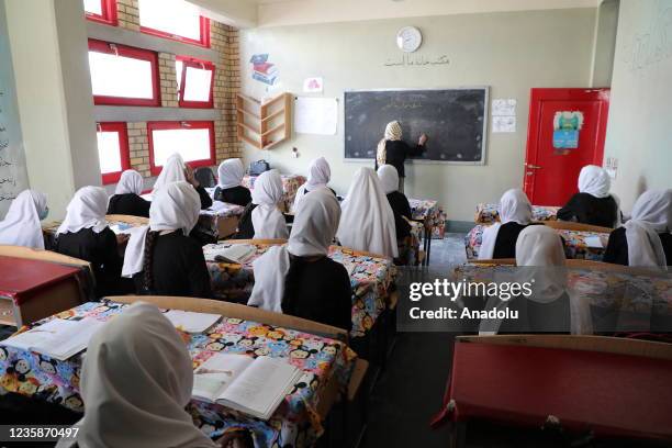 Afghan girls attend a class in a high school in Mazar-i-Sharif, Afghanistan on October 10, 2021. High school education continues for girls in only...